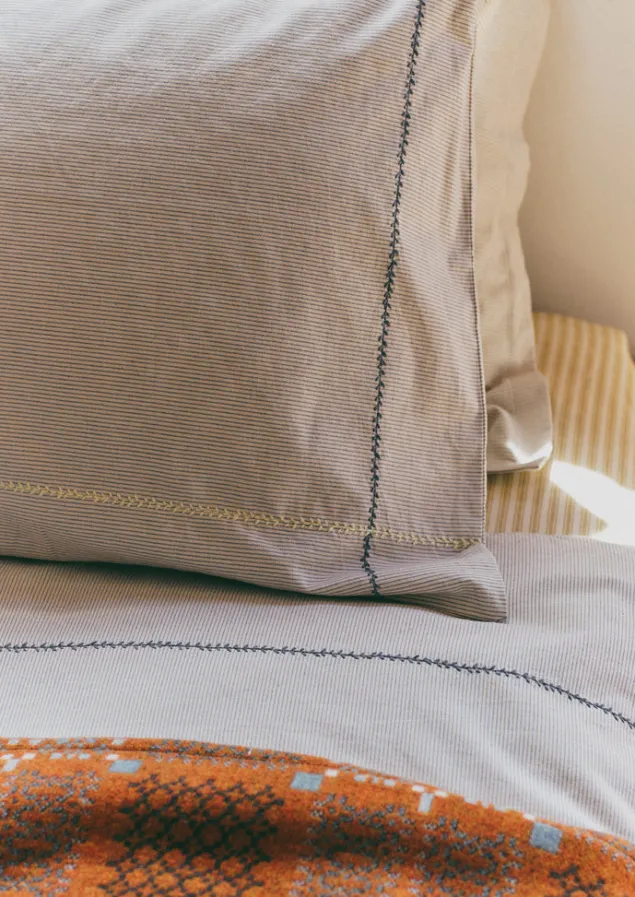 fine_stripe_organic_cotton_embroidered_pillowcase_6.webp Textiles | Bed Linen-TOAST Fine Stripe Organic Cotton Embroidered Pillowcase Ecru/SmokeBlue