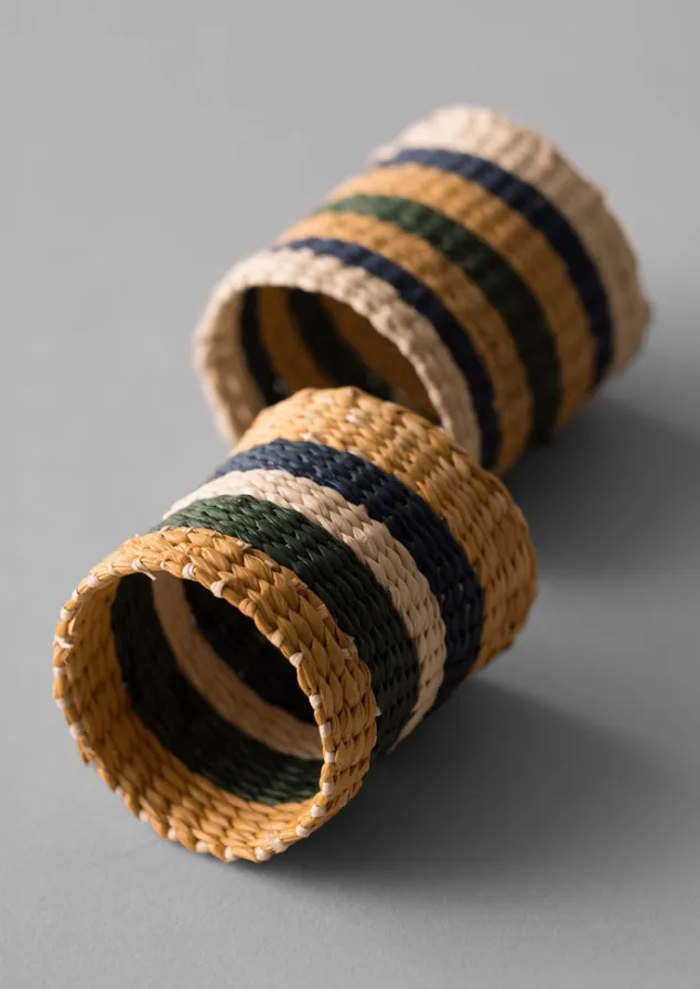 hand_woven_iraca_napkin_rings_10-3.webp Textiles | Kitchen-TOAST Hand Woven Iraca Napkin Rings Brick/Multi