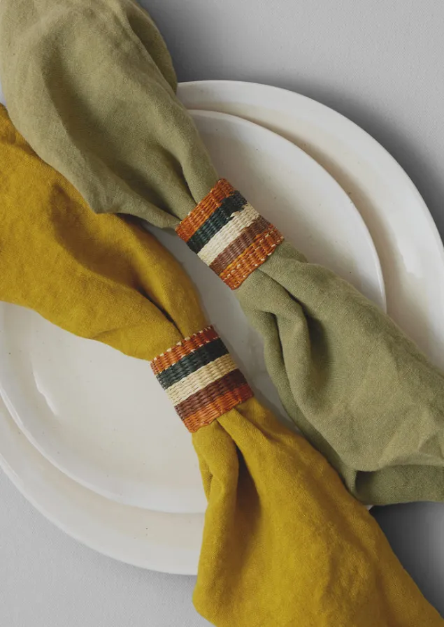 hand_woven_iraca_napkin_rings_7-5.webp Textiles | Kitchen-TOAST Hand Woven Iraca Napkin Rings Sand/Multi