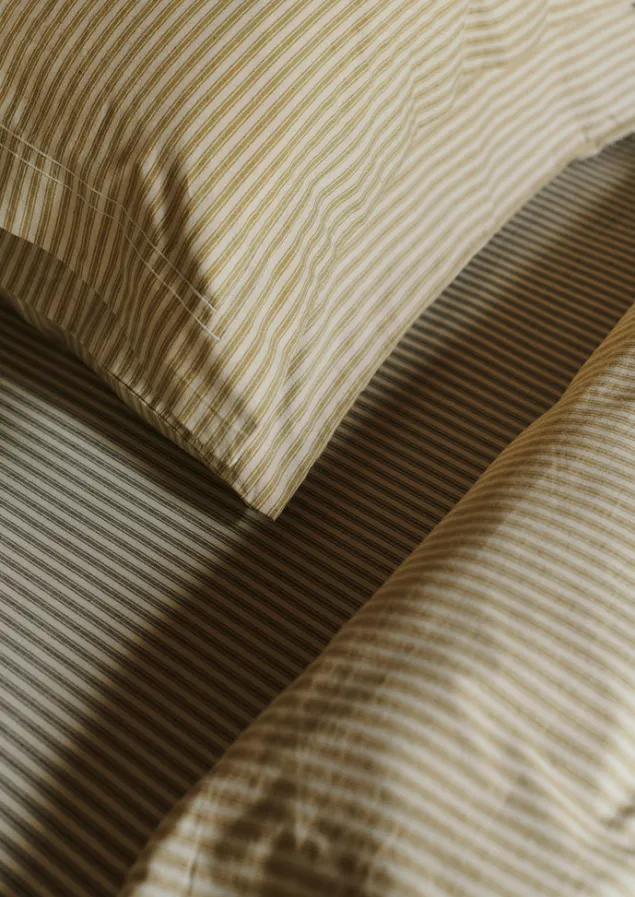 organic_cotton_ticking_stripe_oxford_pillowcase_2.webp Textiles | Bed Linen-TOAST Organic Cotton Ticking Stripe Oxford Pillowcase Ecru/Straw